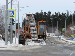 A snow plowman clearing the streets of snow after a blizzard. Snow removal equipment on the streets...