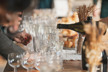 The guests pouring champagne at a wedding
