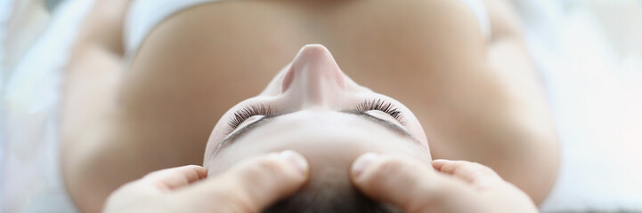 Naklejka premium Spa worker using fingers for massage