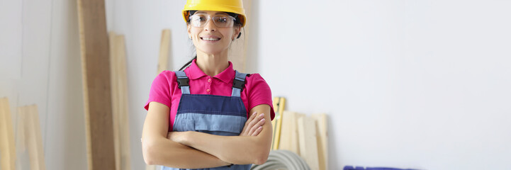 Smiling confident female worker in room