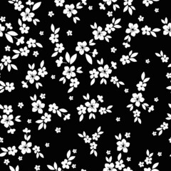 Seamless vintage pattern. white flowers and leaves. Black background. vector texture. fashionable print for textiles, wallpaper and packaging.
