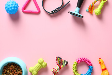 Flat lay composition with pet accessories and bowl of dry food on pink background. Pet care and training concept. Pet shop banner design.