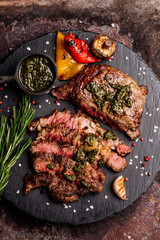 Top view of delicious grilled beef steak and vegetables served