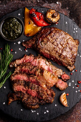 Top view of delicious grilled beef steak and vegetables served