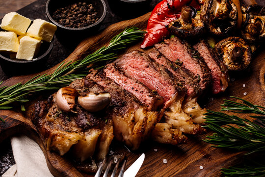 Top view of delicious grilled beef steak and vegetables served