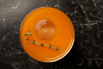 Fresh cocktail with bourbon and ice with thyme