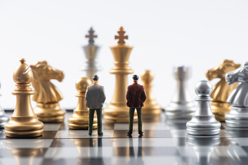 Businessman miniature  standing on chessboard,Business and Competition Concept. 