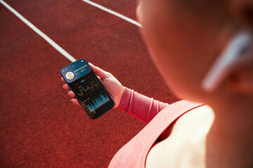 Gym application. Smart phone screen with fitness health or sport gym mobile application. Female...