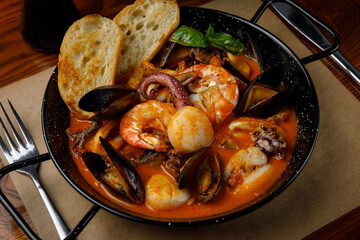 seafood dishes on a wooden table
