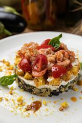 Eggplant dish in a restaurant on a wooden table
