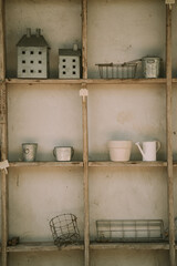A wooden shelf with metal objects. Selective focus