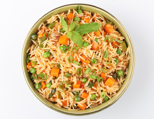 Schezwan Fried Rice is a popular indo-chinese food served in a plate or bowl with authentic sausages. selective focus