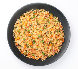 Schezwan Fried Rice is a popular indo-chinese food served in a plate or bowl with authentic sausages. selective focus