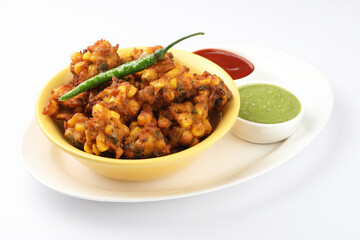 Crispy Corn pakora/pakoda, bhajji, Bhaji, bajji or pattice . served with tomato ketchup & mint...