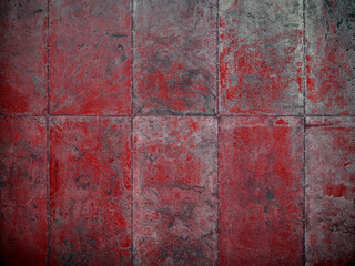 Damaged red metal plate wall