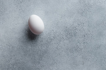 White egg on a concrete table