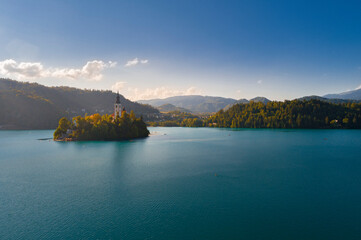 Aerial view of Lake Bled and Historic church located in a calm, picturesque setting on an island accessible by boat.