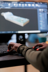 Close up of digital artist working on 3D model to improve geometry and optimise project. Graphics...