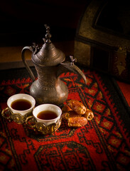 Kahva - Arabic black coffee served in a traditional coffee cups along with sweet dates. Middle...