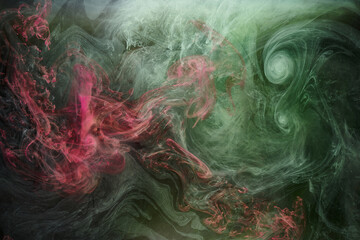 Obraz premium Green pink smoke on black ink background, colorful fog, abstract swirling touch ocean sea, acrylic paint pigment underwater