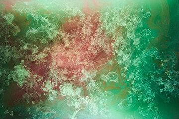 Fototapeta na wymiar Green pink smoke on black ink background, colorful fog, abstract swirling touch ocean sea, acrylic paint pigment underwater