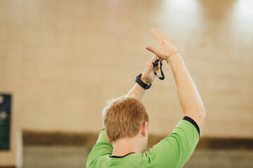 Football referee gesture time out during a football game on on a soccer field