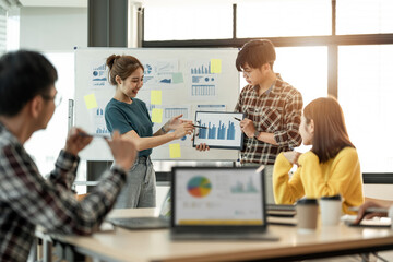 Diverse colleagues collaborative brainstorming at office briefing. young business man and woman explaining analysis at the meeting startup work.