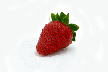Red strawberry isolated on white background with water drops