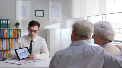 Aged couple have appointment with investment specialist - Powered by Adobe