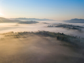 Morning fog in the Ukrainian Carpathians. Aerial drone view.