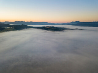 Morning fog in the Ukrainian Carpathians. Aerial drone view.