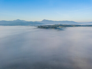 Morning fog in the Ukrainian Carpathians. Aerial drone view.