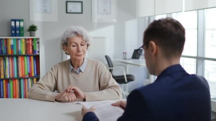 Senior woman sign papers for educational program 