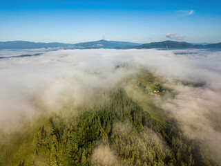 Foggy summer morning in the Ukrainian Carpathians. Aerial drone view.
