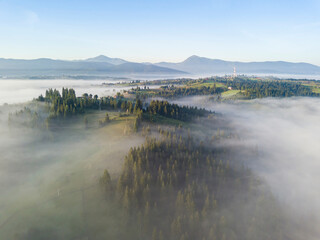 Morning fog in the Ukrainian Carpathians. Aerial drone view.