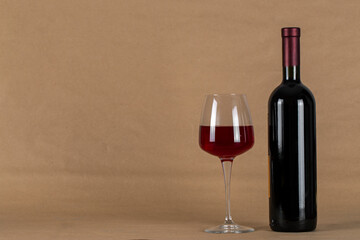 Wine bottle and glass . Space for text.