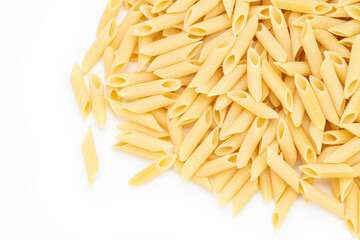 Pennette rigate. Raw pasta on white background. Space for text.