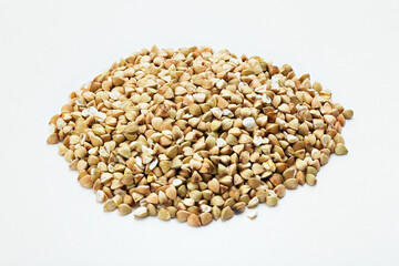 Pile of buckwheat on white background. Buckwheat.