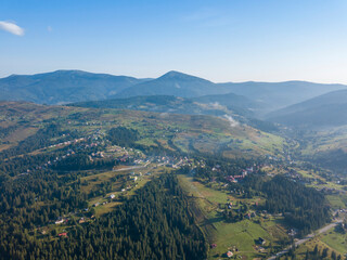 Fototapeta premium Ukrainian Carpathians mountains on a summer morning. Aerial drone view.