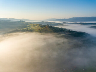 Morning fog in the Ukrainian Carpathians. Aerial drone view.