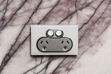 Silver socket on marble wall