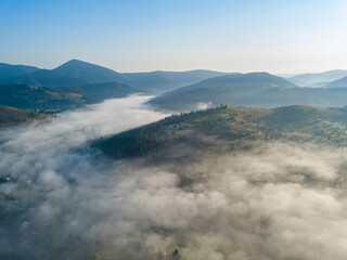 Morning fog in the Ukrainian Carpathians. Aerial drone view.