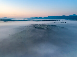 Morning fog in the Ukrainian Carpathians. Aerial drone view.