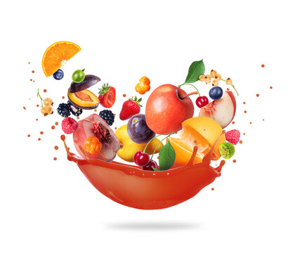 Different fruits and berries with splashes of juice isolated on a white background