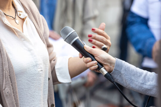 Journalist Making Media Or Vox Pop Interview With Unrecognizable Female Person