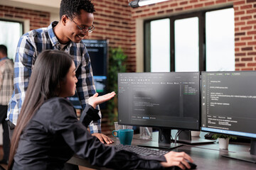 Programmers questioning source of cyber attacks and system security coverage. Software technician...