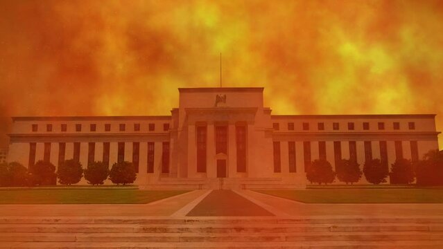 An abstract concept of a global financial and economic crisis with the Federal Reserve building in Washington, D.C. USA engulfed in orange smoke and burning embers.
