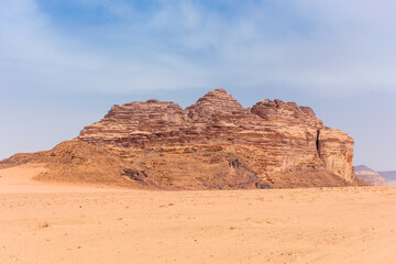 Fototapeta na wymiar Sands and mountains of Wadi Rum desert in Jordan, beautiful daytime landscape