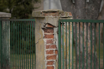 Brick pole damaged by time and weather