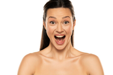 Portrait of shirtless happy surpriseed woman on a white background